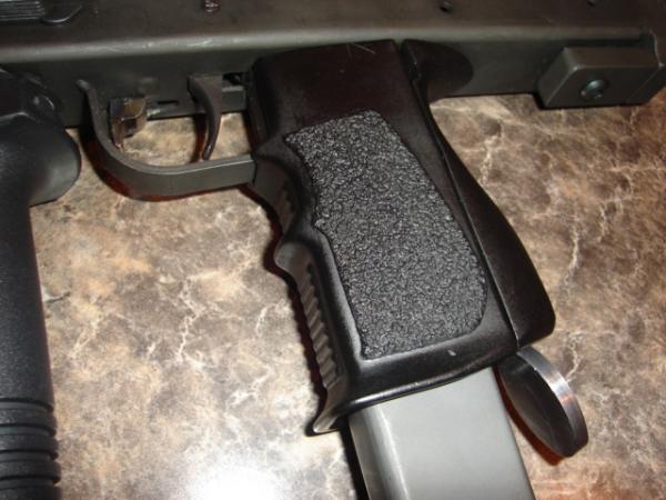 Molded wrap around grip for M-11 9mm